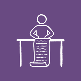 Small business owner at desk with to-do list